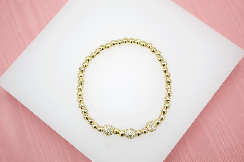 18K Gold Filled 4mm Gold Elastic Bead Bracelet With Three Round CZ Charm